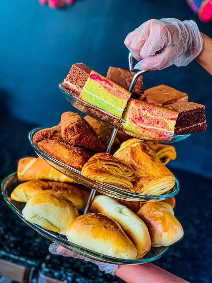 A three-tier selection of WellOn buns, pastries and cakes